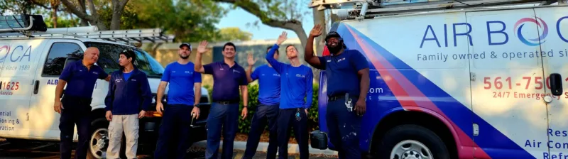 Image for a group of men in blue shirts waving